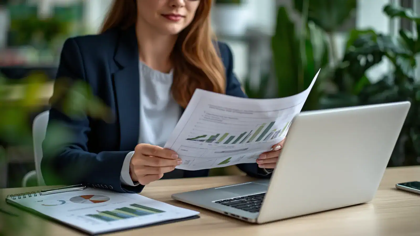 Environmental and sustainability professional reviewing career development and membership documents